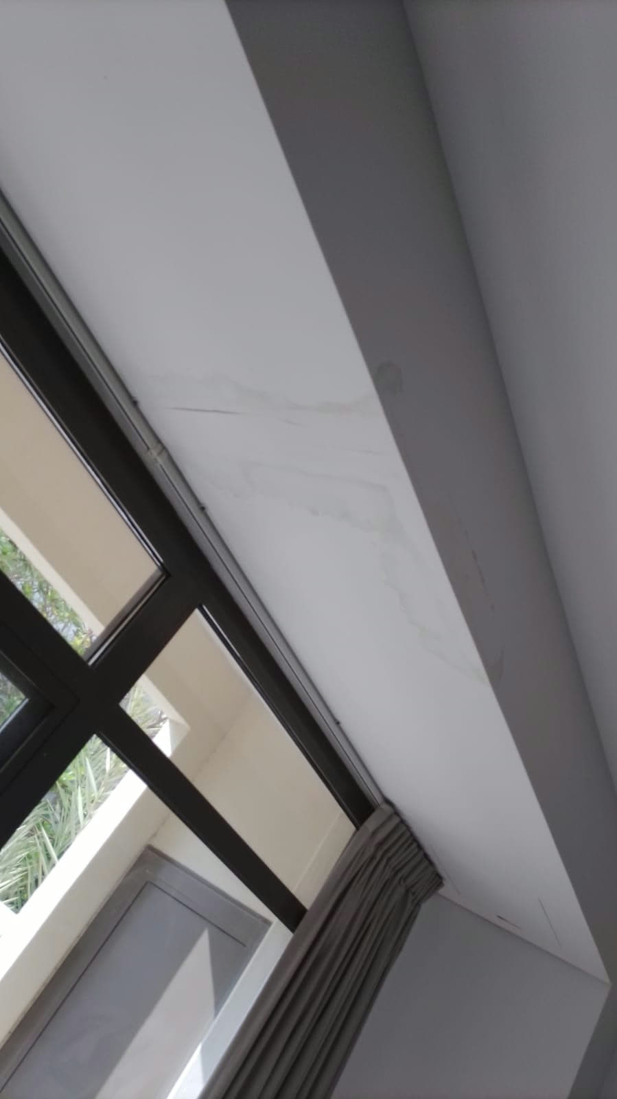 Painting before: Ceiling stained by a past water leak.
