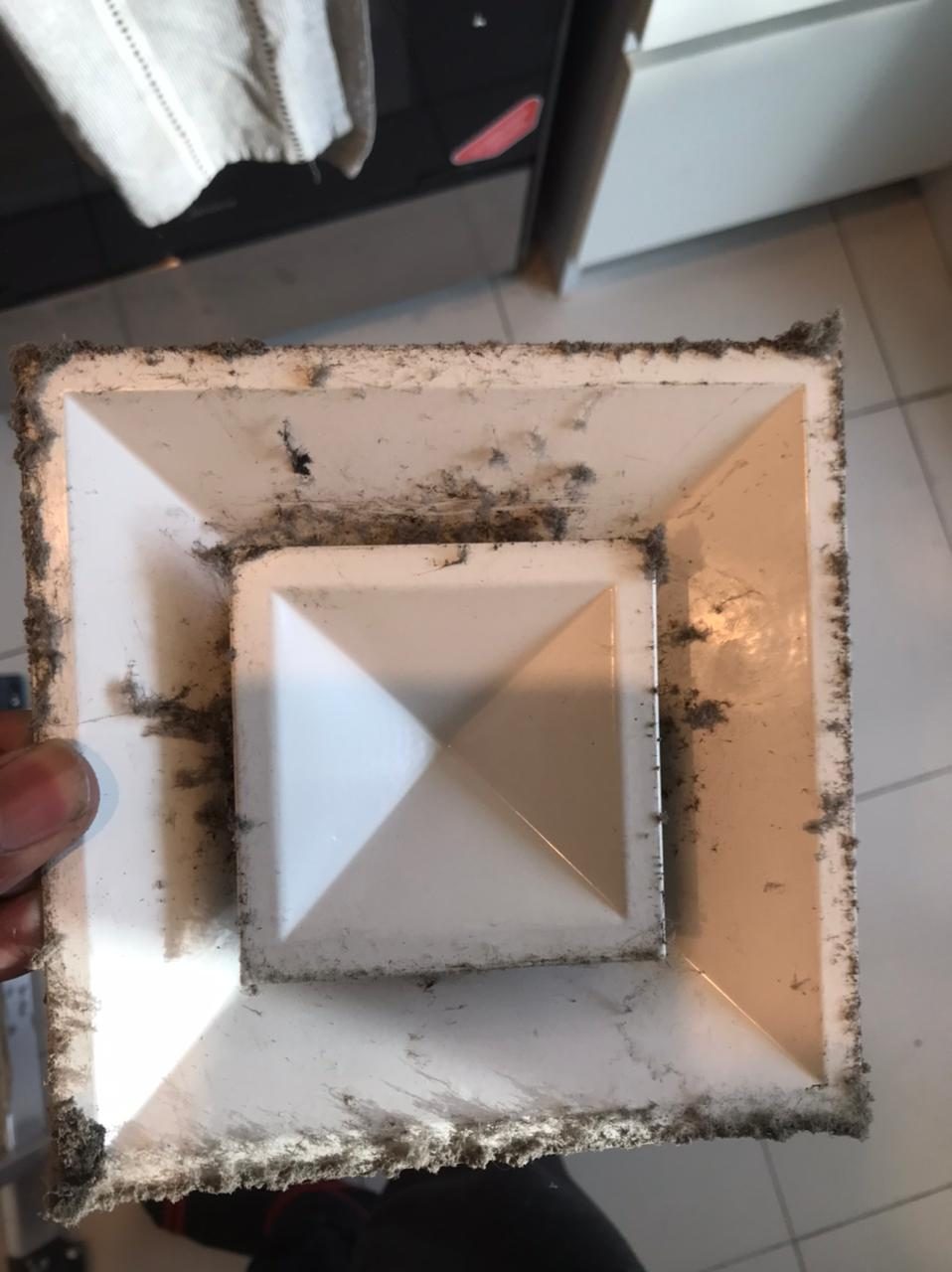HVAC before: Ceiling diffuser black with dust and mould.