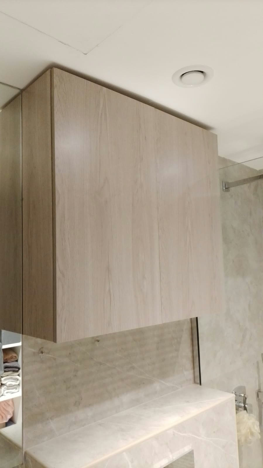 Carpentry: Fitted vanity cabinet installed.